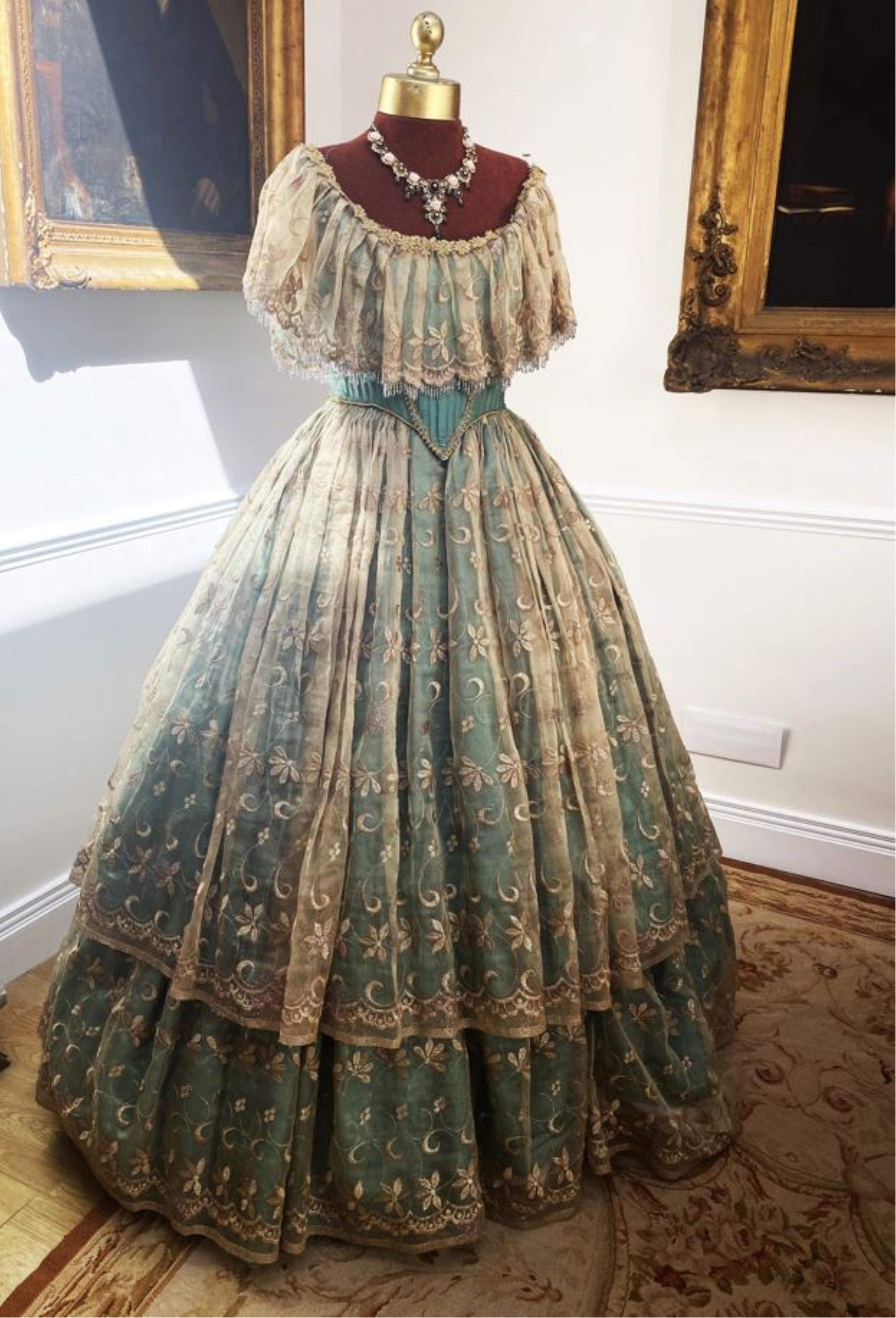 A Victorian style evening gown – green silk with gold transparent overskirt. Size adjustable 10/14